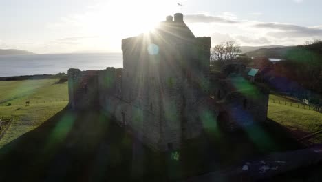 aerial - skipness castle on a sunny day, kintyre, scotland, wide truck right shot