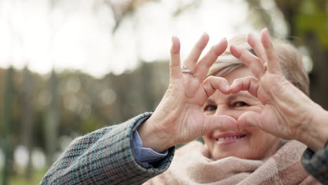Senior-happy-woman,-heart-hands