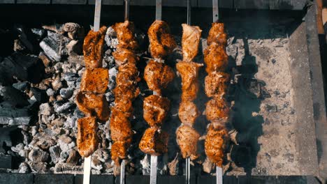 top view on shish kebab cooked on the grill in nature. street food