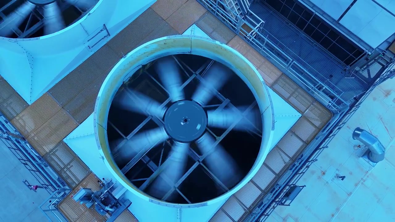 Data center HVAC cooling system with large industrial fans spinning on a rooftop in New Albany, Ohio