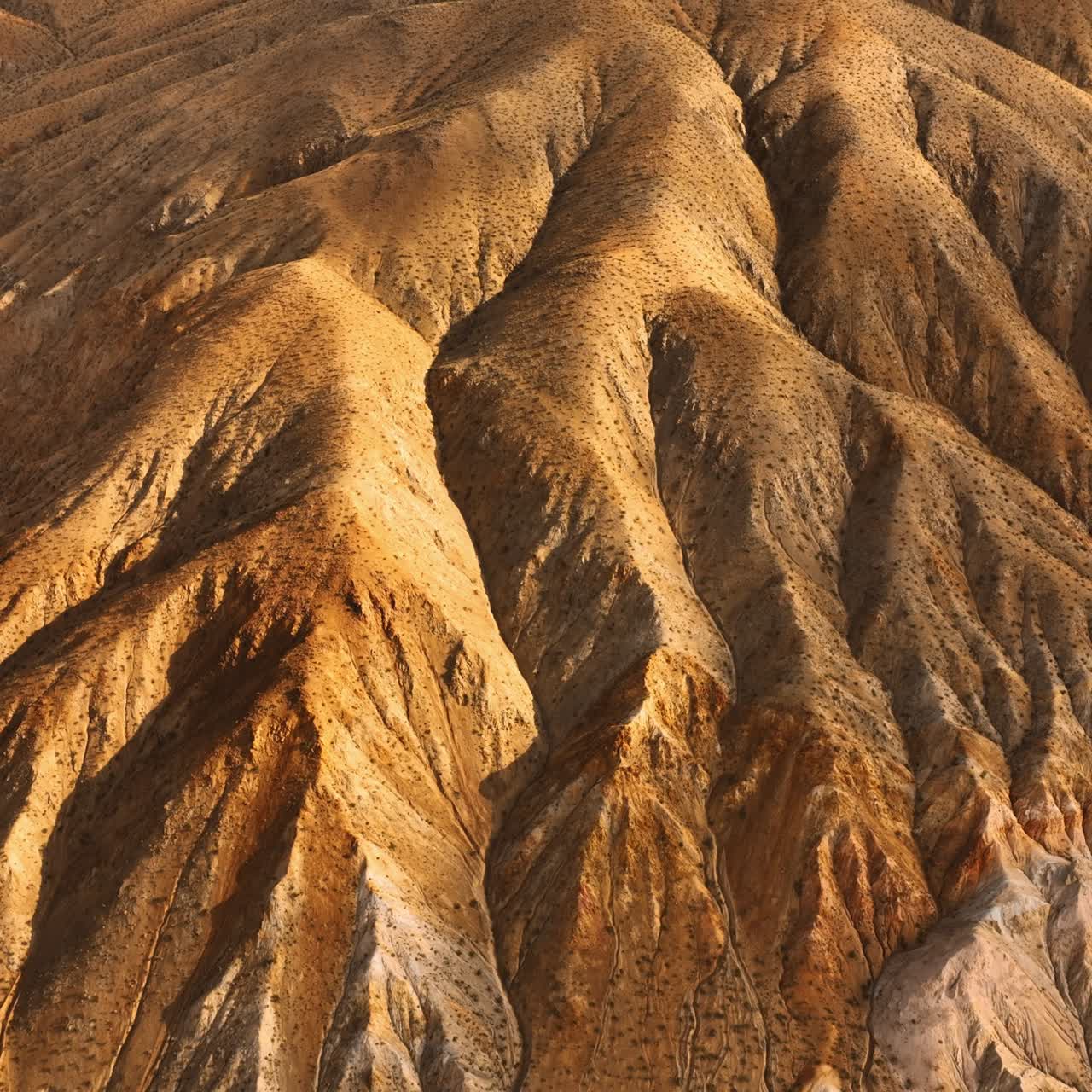 Amazing rock formations with no plants growing on. Drone approaching mountains in Nevada, USA