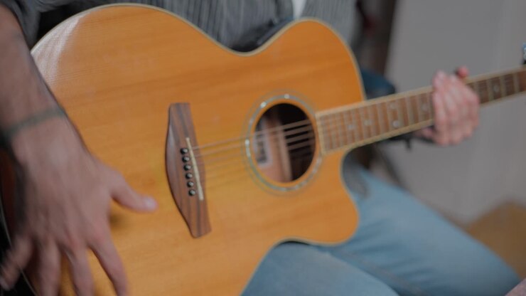 Man Playing Acoustic Guitar Closeup