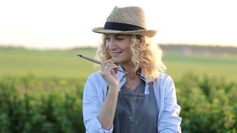 artist girl paints a picture outdoors