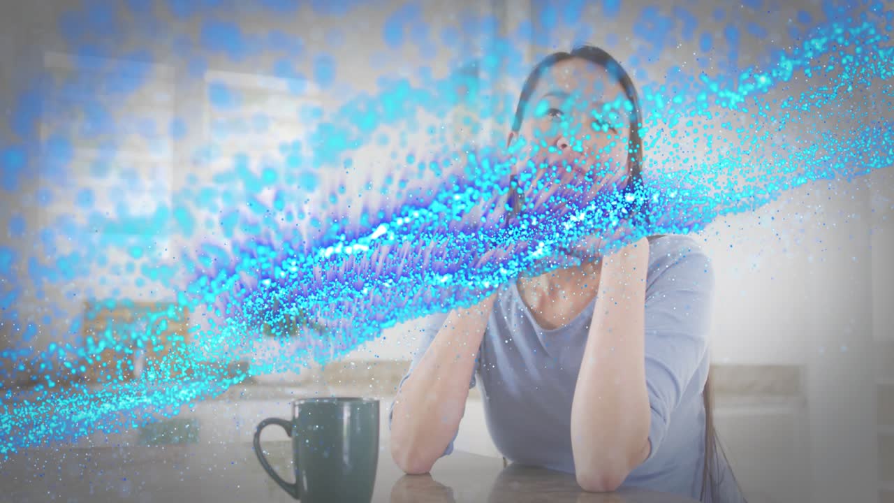 Woman holding dark green mug while technology wave sweeping counter inducing thoughtful gesture