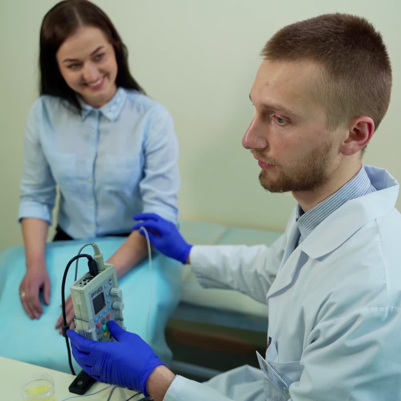 Physician treating young woman. Portrait of young doctor examining patient health