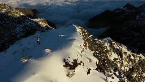 a man is walking alone up the path to the top of the mountain pico ruivo in madeira