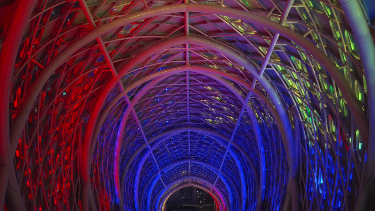 Beautiful footage of Saloma Link Bridge showcasing its architectural curves and colorful LED lights glowing at night