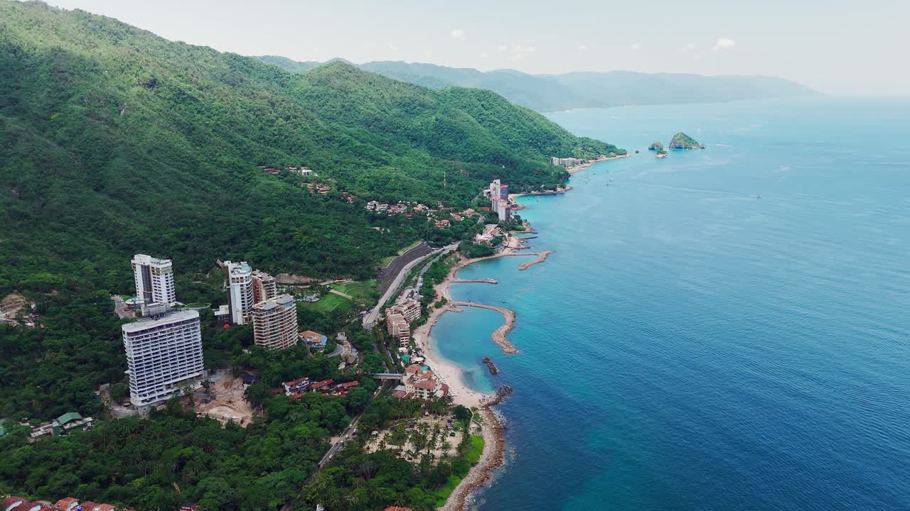 Drone revealing the charm of Puerto Vallarta, Mexico, exotic beaches, and mountains