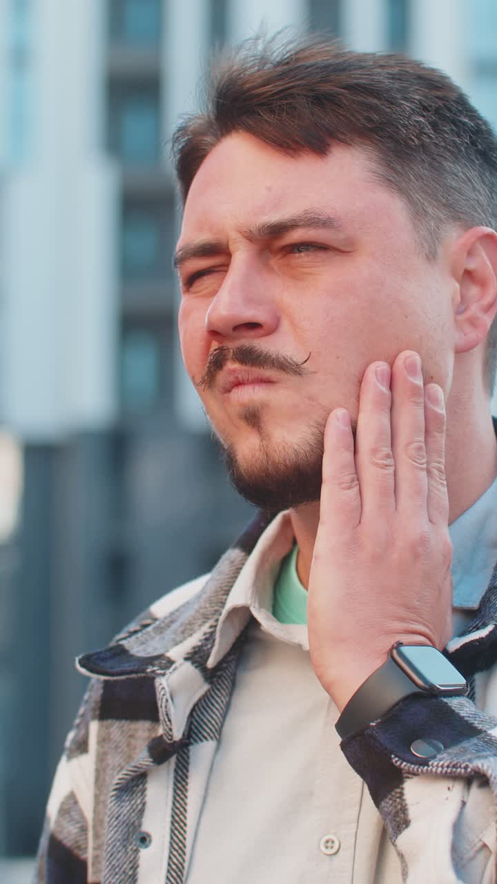Mature caucasian businessman feeling toothache bad unpleasant symptoms suffering from pain outdoors