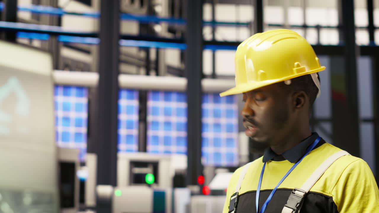 Vertical video Technician in industrial plant using tablet app to diagnose equipment errors