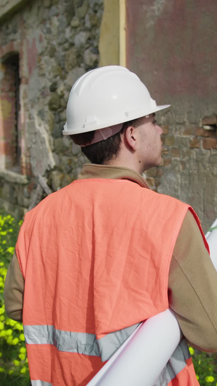 Engineer Walking At The Construction Site Immersed In The Nature