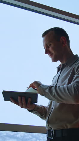 office worker with phone. amazed happy businessman receiving reading good news. vertical video