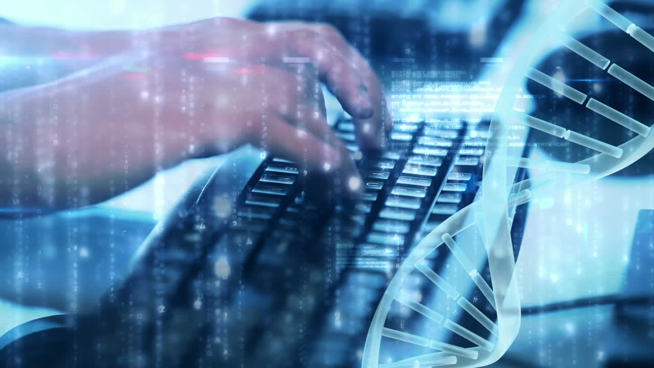 Man writing on the computer with a spinning DNA