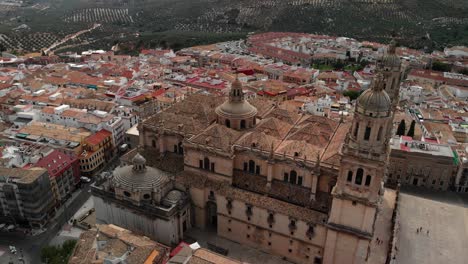 Spain-Jaen-Cathedral,-Catedral-de-Jaen,-flying-shoots-of-this-old-church-with-a-drone-at-4k-24fps-using-a-ND-filter-also-it-can-be-seen-the-old-town-of-Jaen