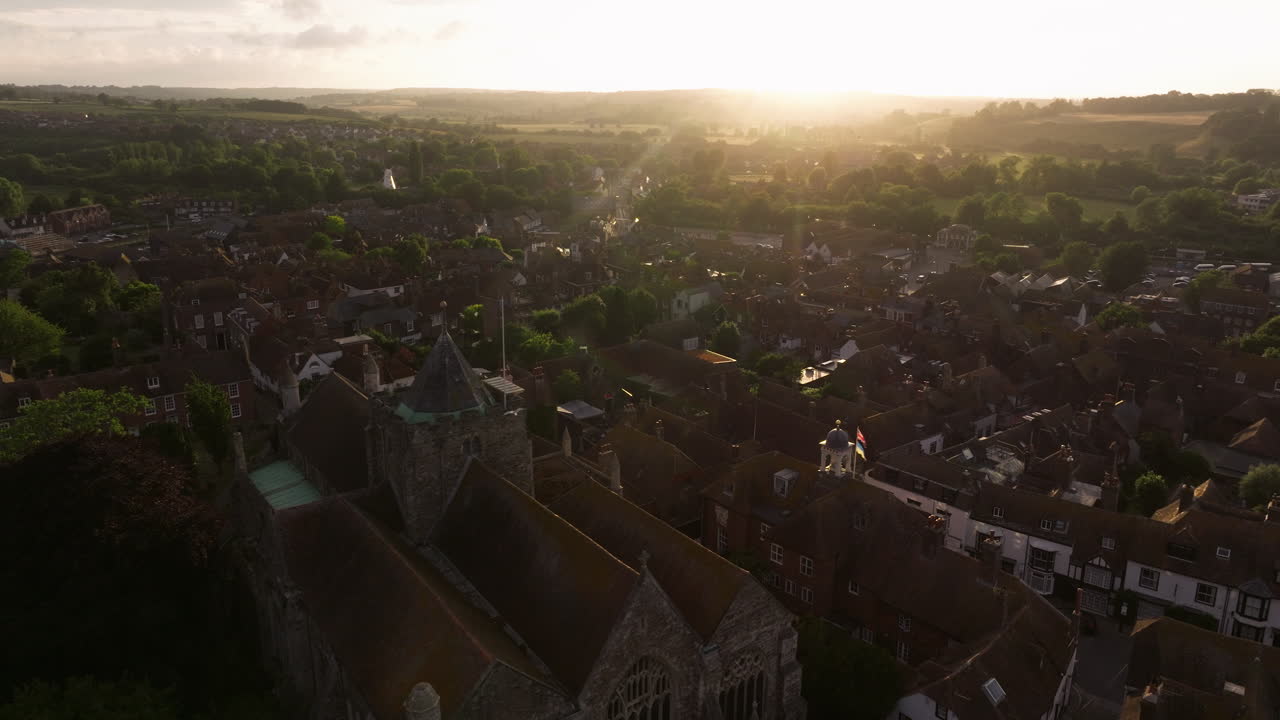 Charming Town Of Rye With Historic Buildings And Church At Sunset In East Sussex, England, UK. - aerial shot