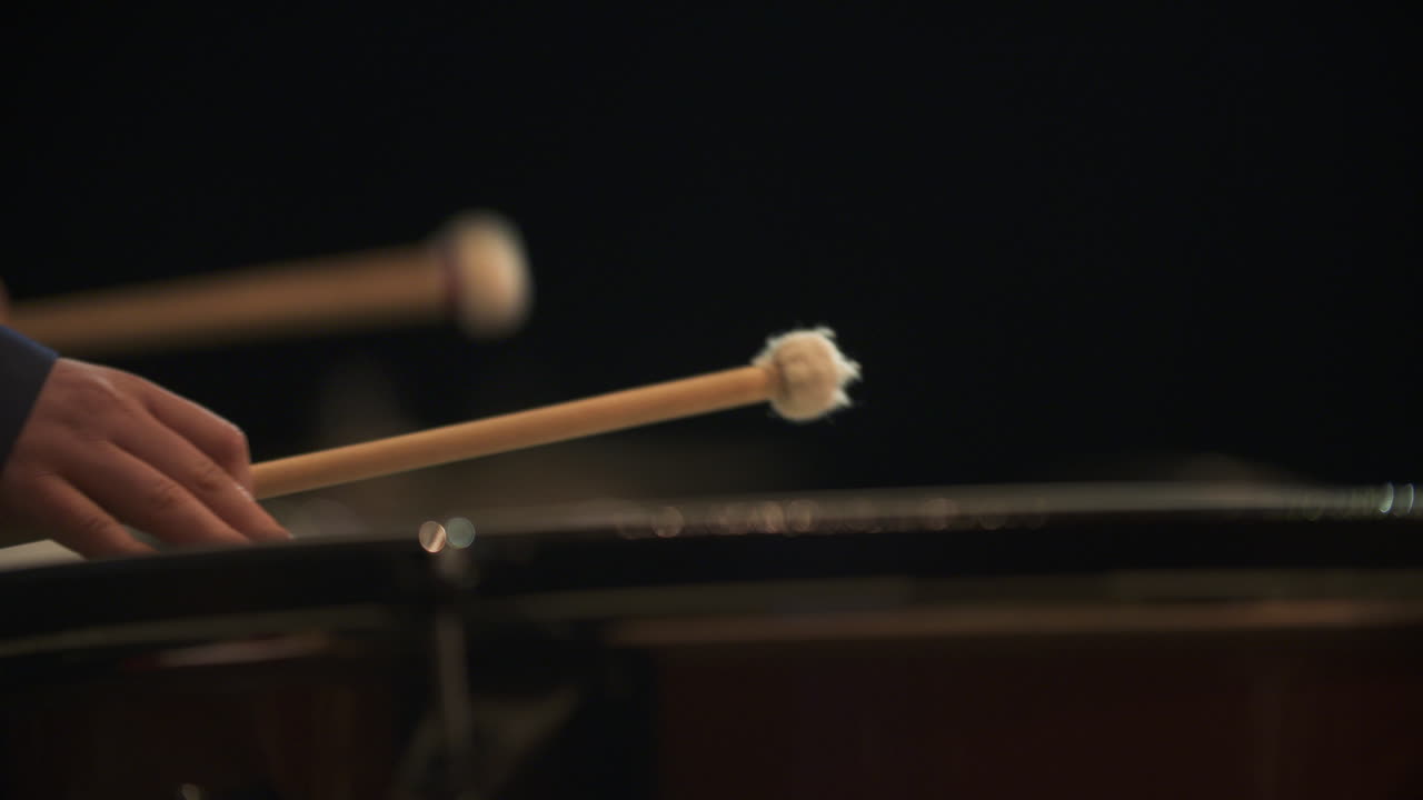 Close-up of a Musician Playing Timpani Drums