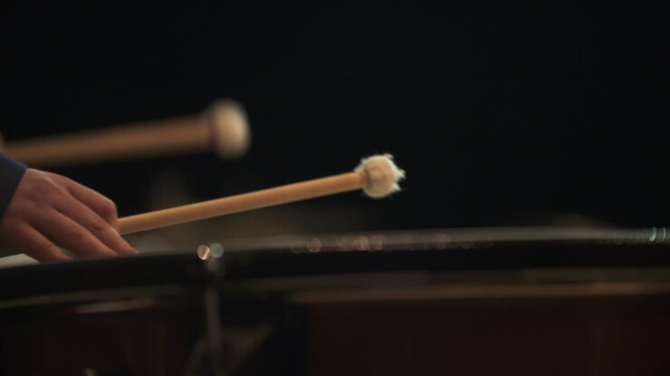 Close-up of a Musician Playing Timpani Drums