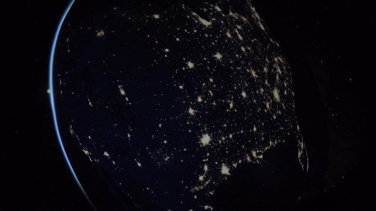 Planetarium show about the Earth as view from space with presenter pointing out specific points