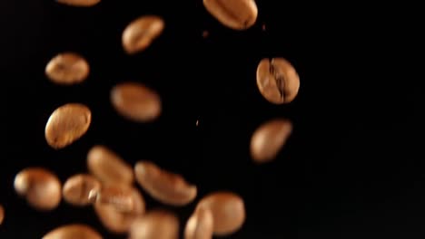 falling coffee beans on the black background 4k