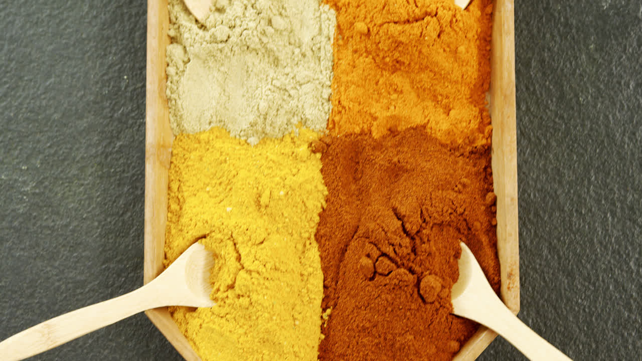 Various spices arranged in tray 4k