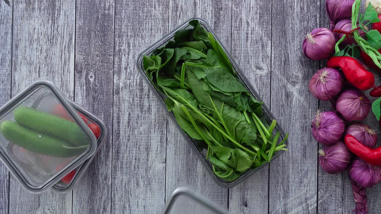 Spinach and vegetables in containers
