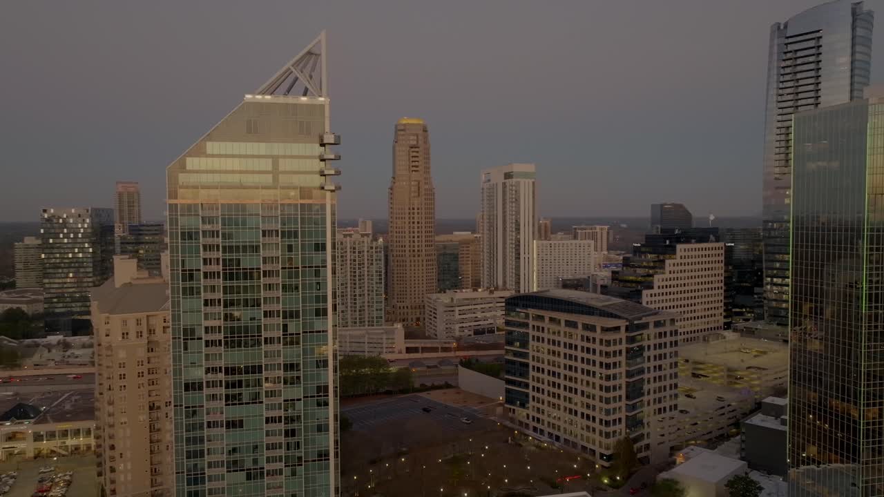 Revealing Buckhead uptown neighborhoods, commercial and residential sovereign skyline at sunset, Drone shot