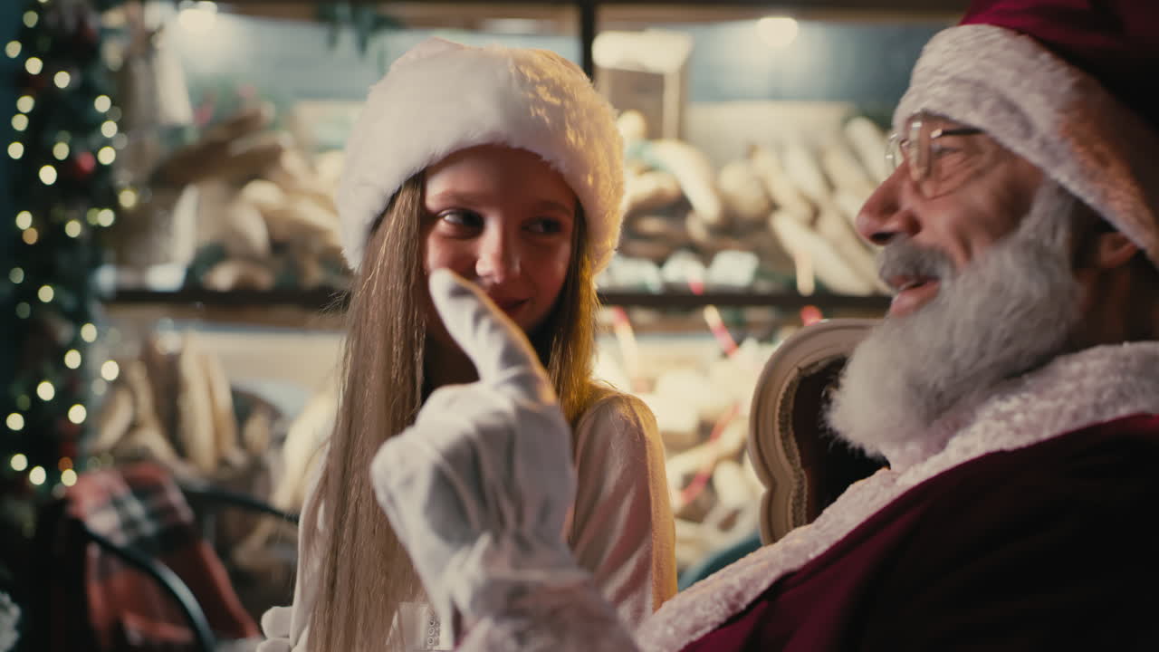 Santa Claus and a young girl at Christmas time