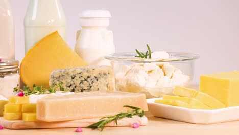 variety of dairy items displayed on wooden surface