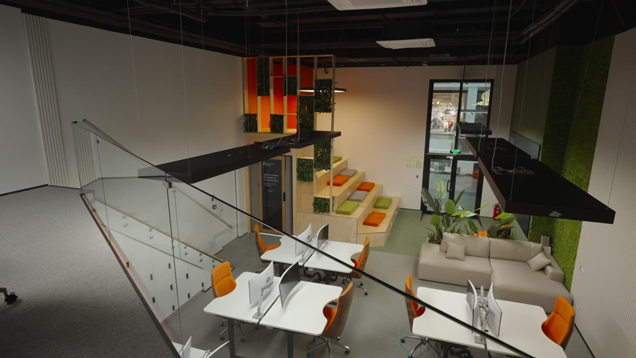 Studio Overview With Stairs And Collaborative Pods, Glass Balustrade And Orange Chairs Mezzanine Vantage. Creative