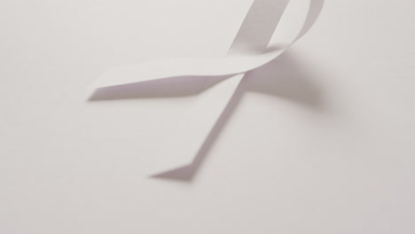 Video-of-white-lung-cancer-ribbon-on-white-background
