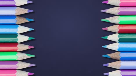 animation of colorful pencils against blue background