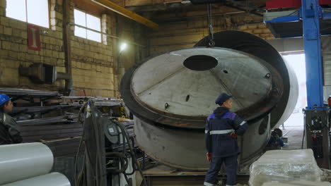 Large Metal Tank Assembly in Industrial Facility