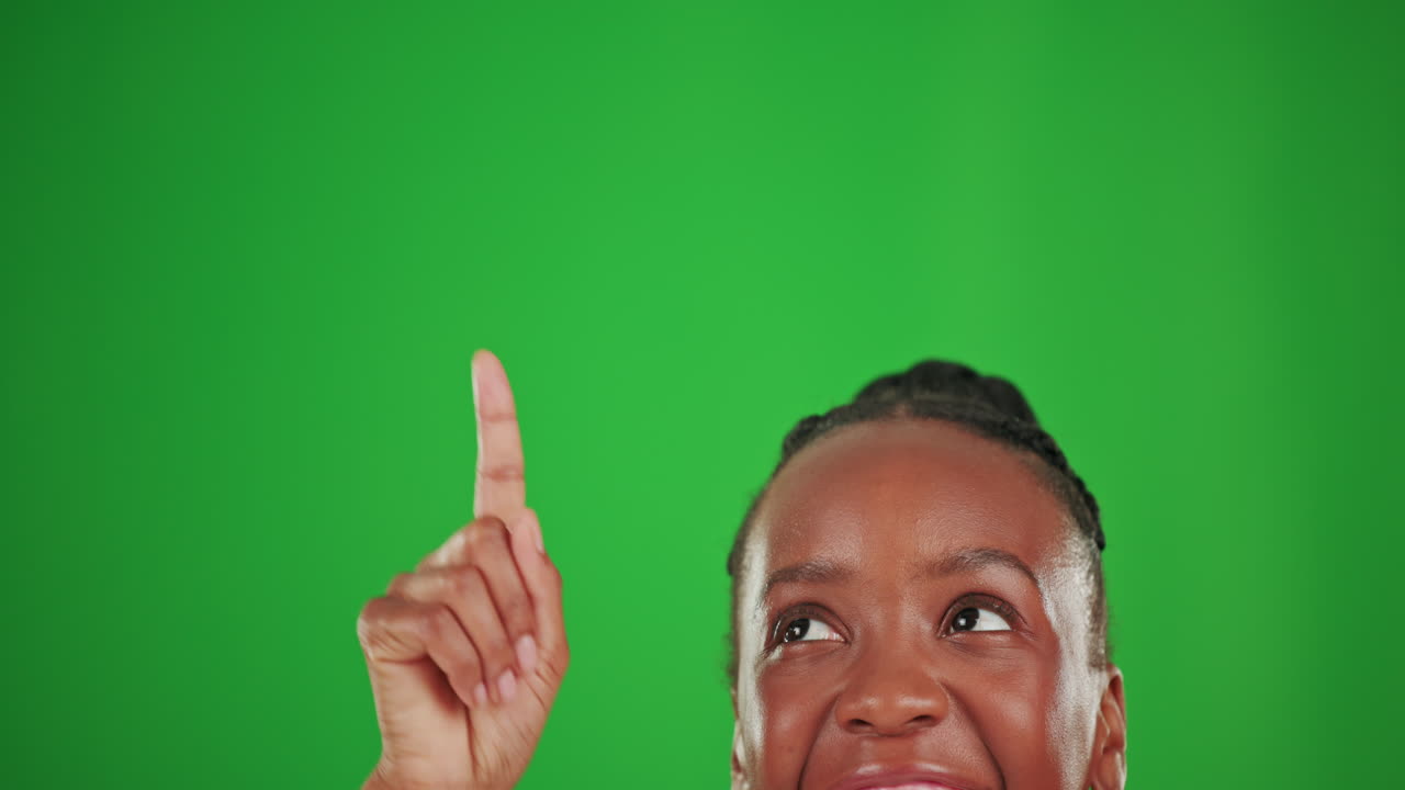 Woman Pointing Up on Green Screen
