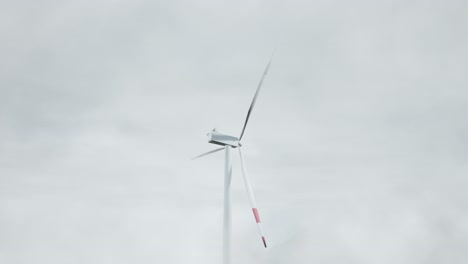 wind turbine in cloudy sky