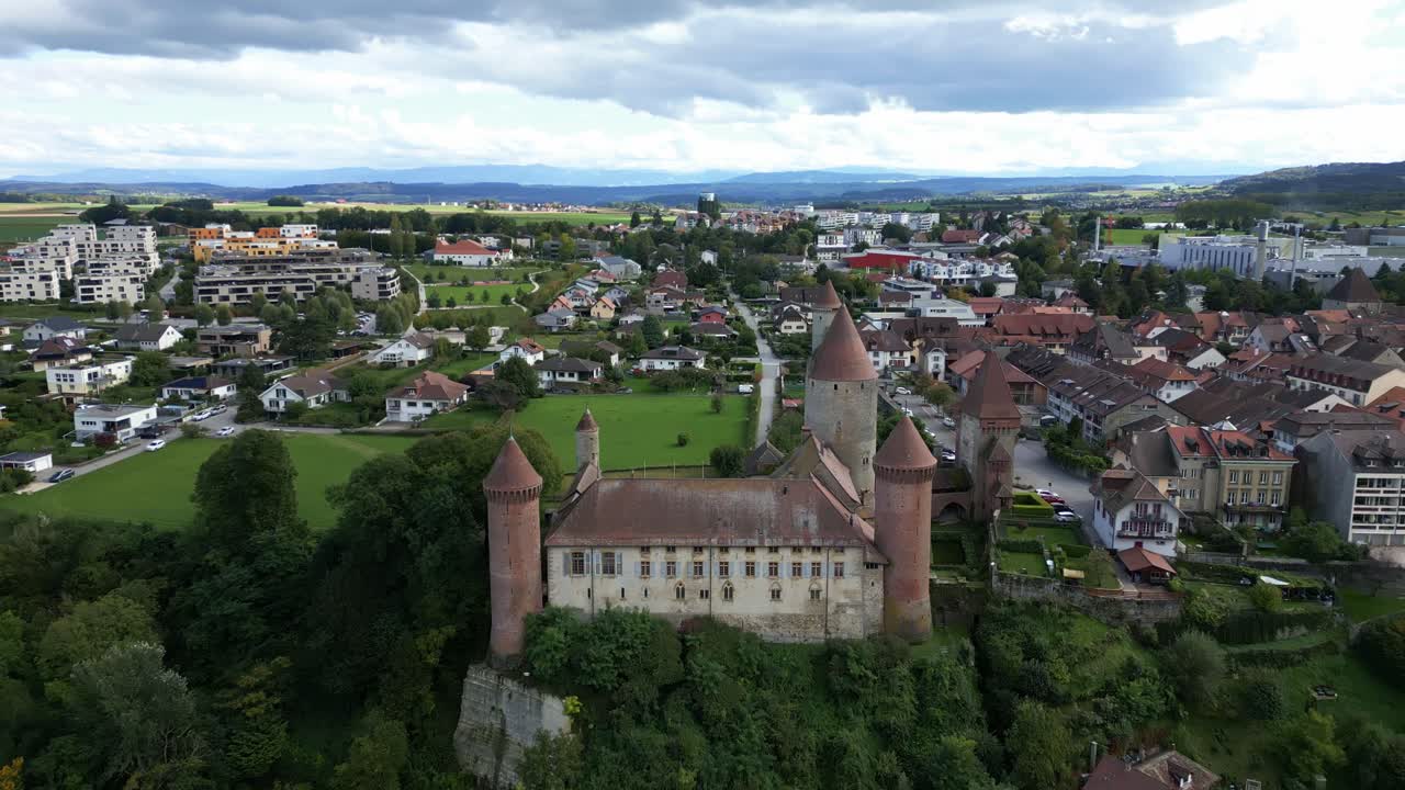 Dolly out drone shot of Chenaux Castle in Estavayer-le-Lac in Canton of Fribourg Switzerland