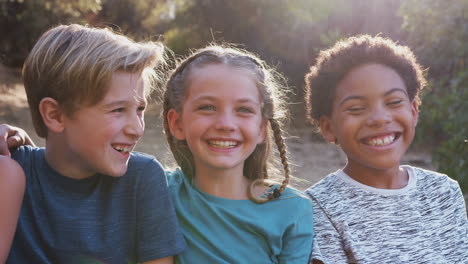 portrait of multi-cultural children hanging out with friends in countryside together