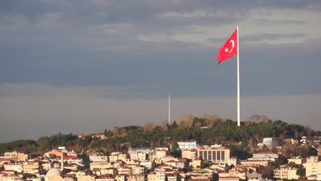 turkish flag over istanbul cityscape