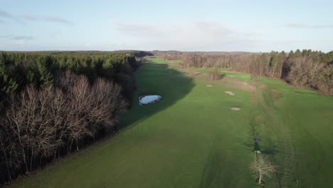 aerial low level drone flying over famous golf course - dolly shot