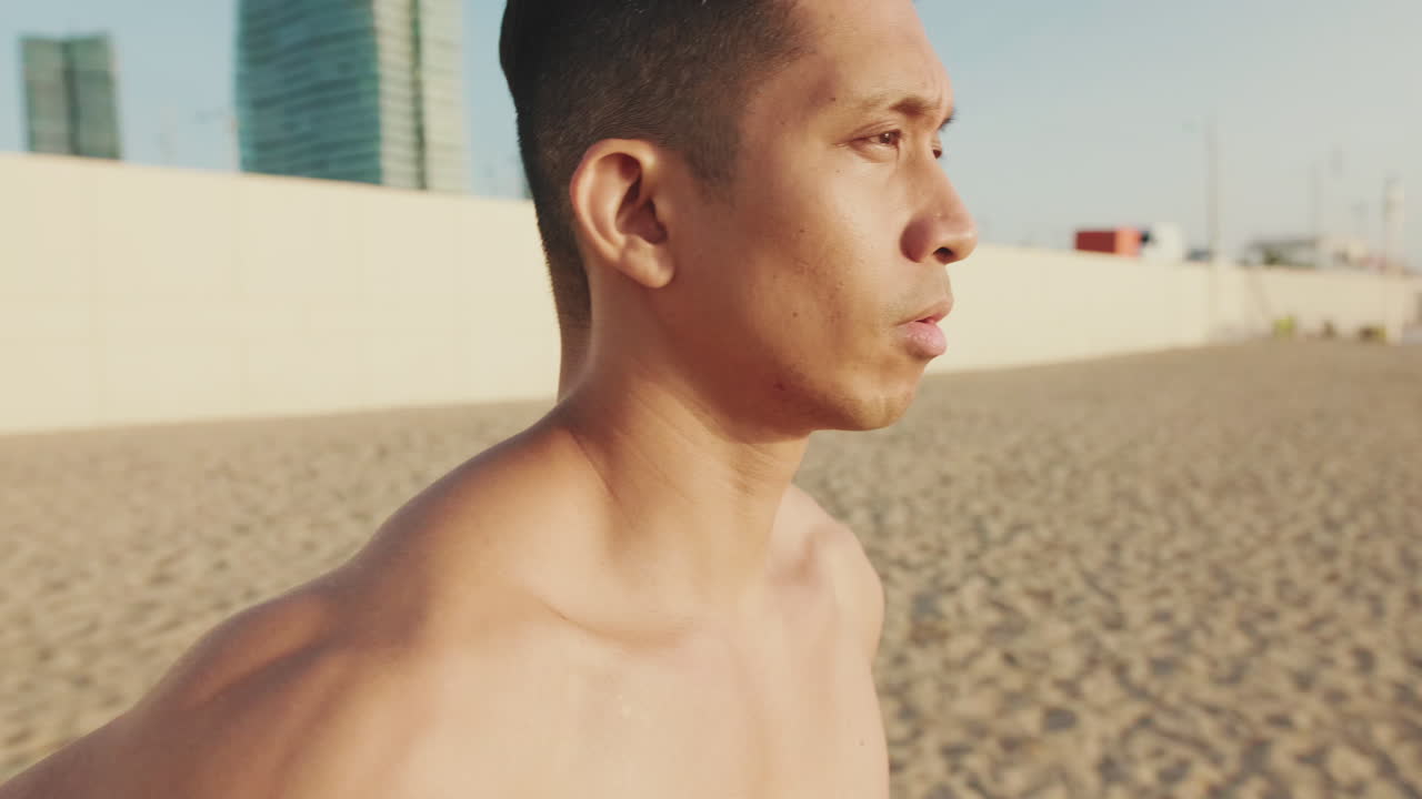 Shirtless man on the beach