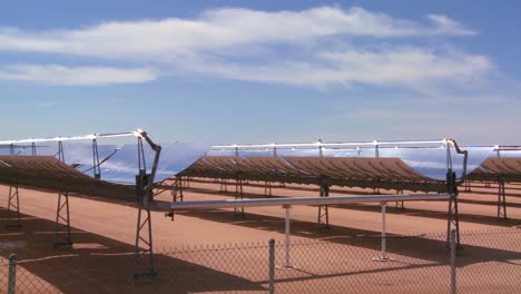 pan across a solar farm in the desert generates electricity 2