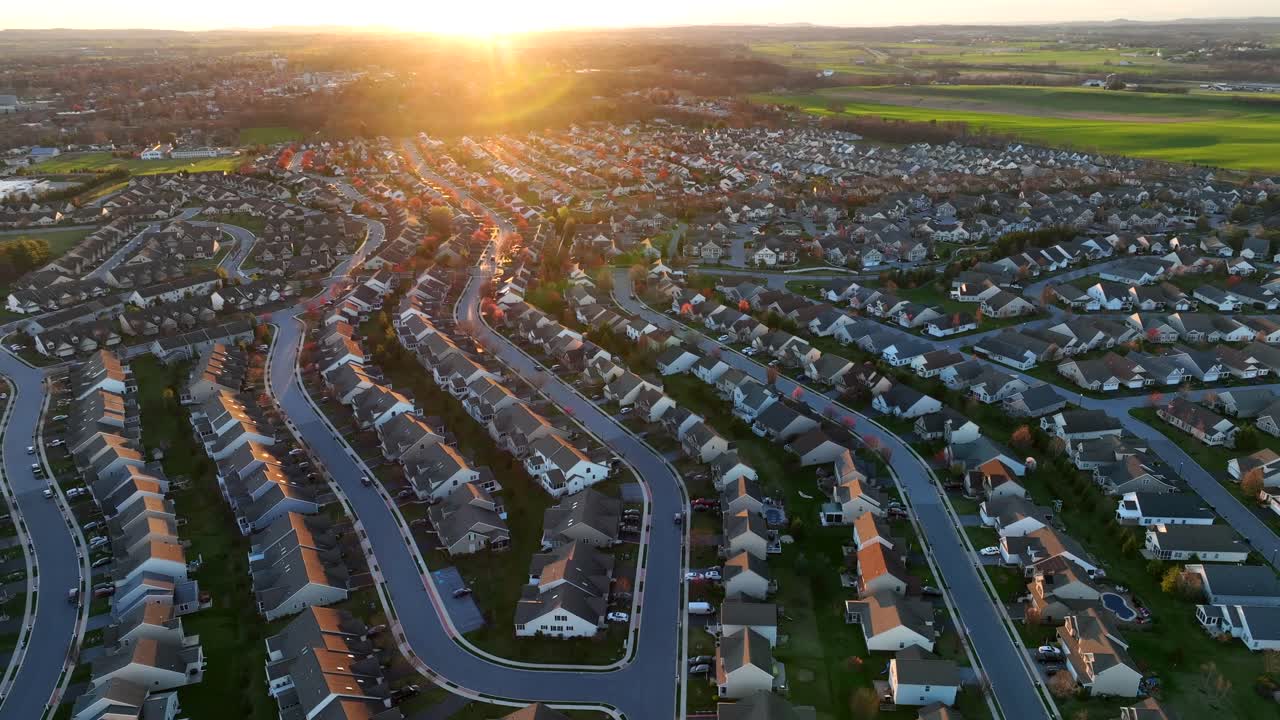 Quaint suburban neighborhood during golden sunset and green garden