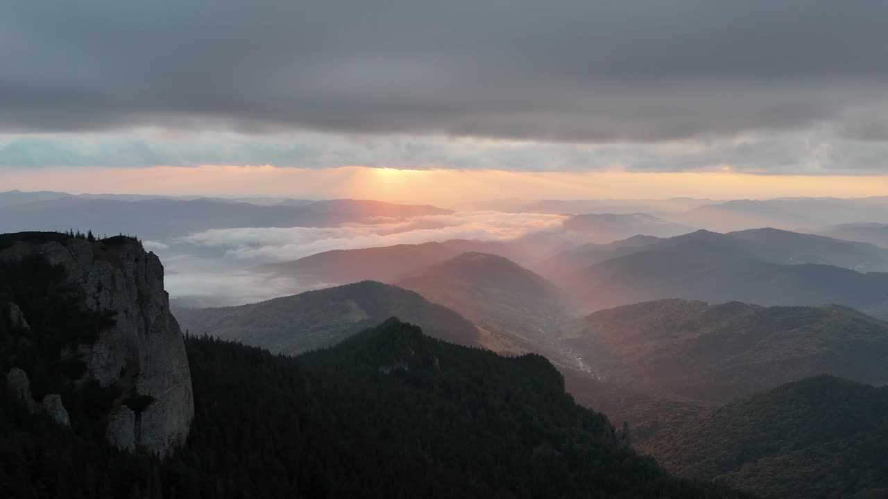 Sunrise over Ceahlau mountain with beautiful sky and forested landscape