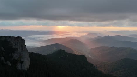 sunrise over ceahlau mountain with beautiful sky and forested landscape