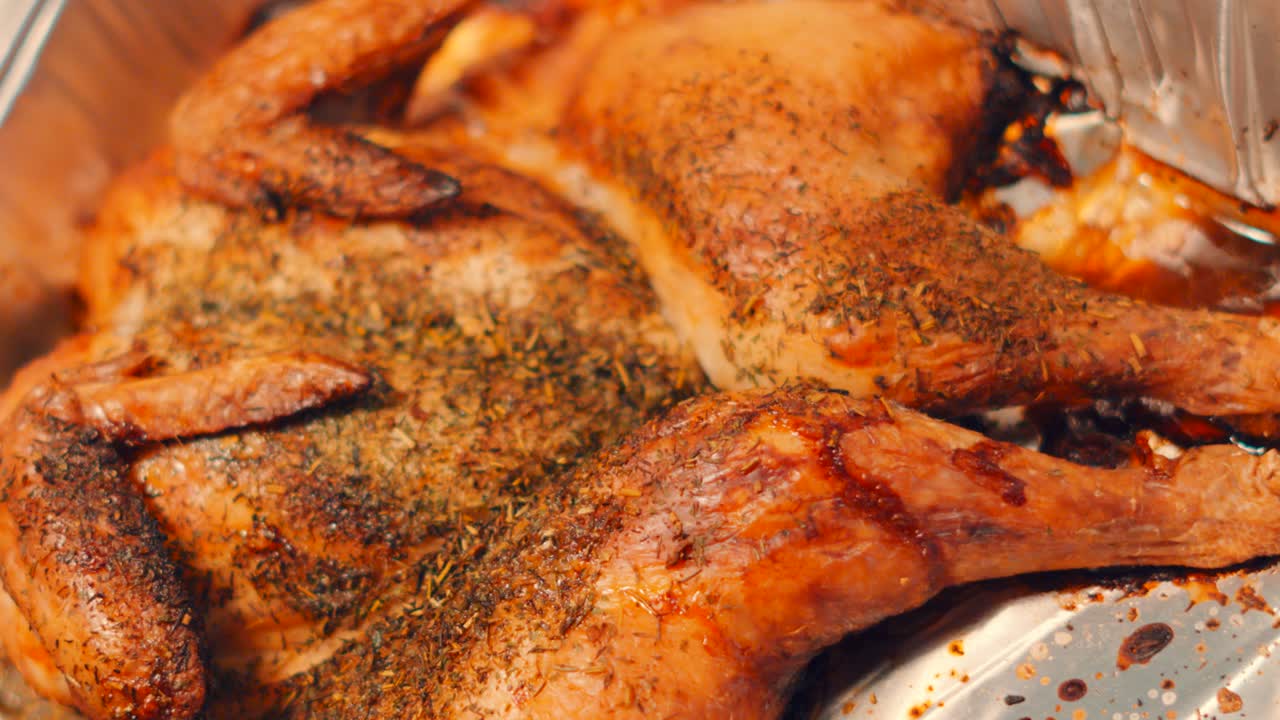 Top View of Cooked British Spatchcock Style Chicken with Thyme Seasoning with Crispy Skin with Wings and Legs. Classic English Cuisine Food