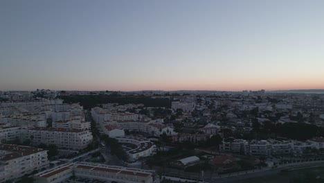 aerial view of lisbon's skyline from cascais, portugal during sunrise