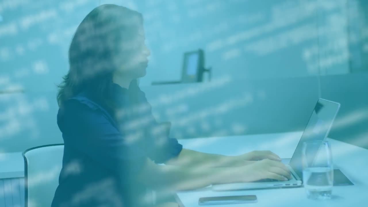 Animation of data processing over businesswoman using laptop