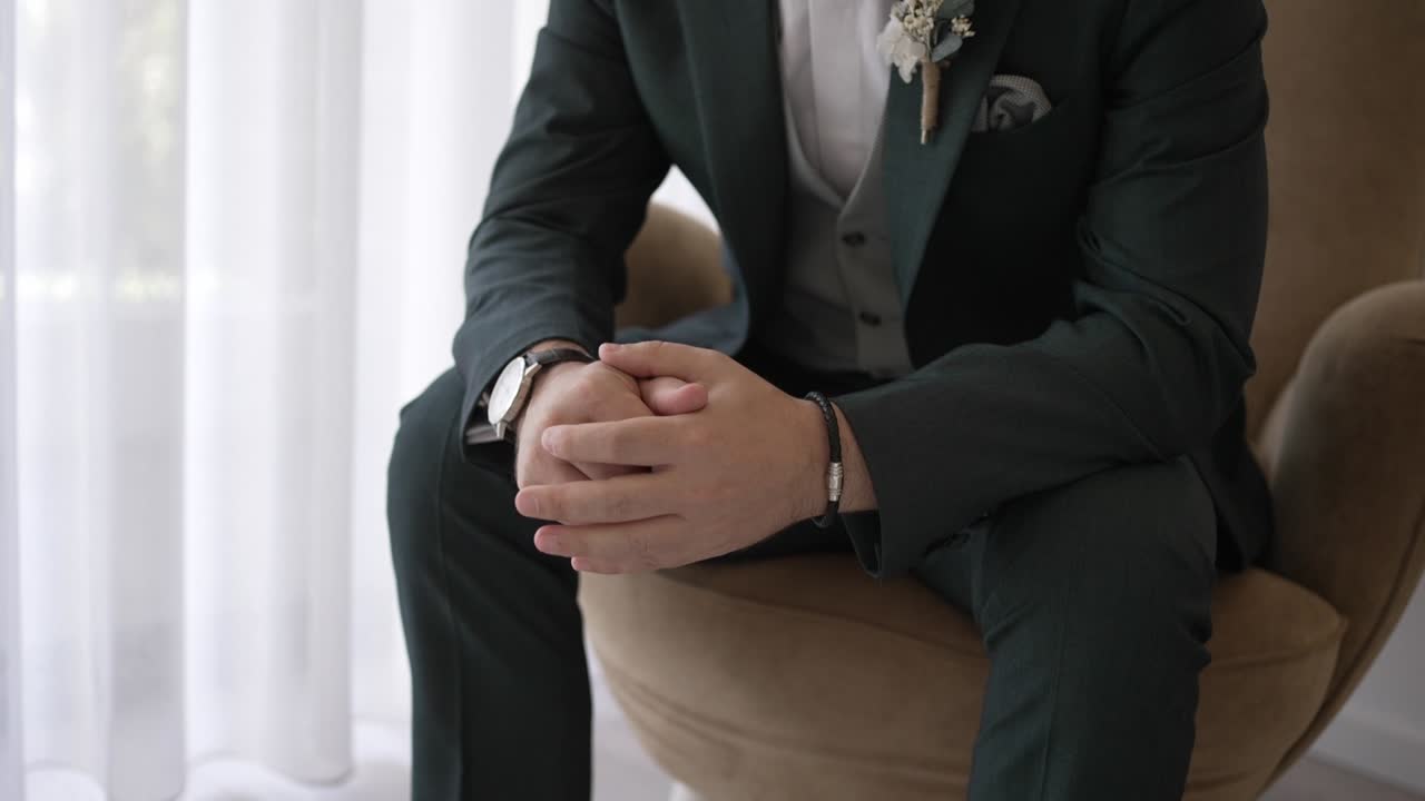 Elegant Groom in Green Suit Getting Ready for his Wedding