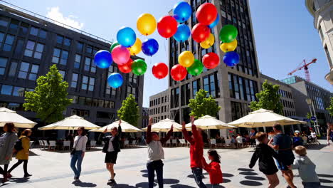 colorful balloons in a city square