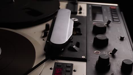 playback of reel-to-reel audio tape on professional magnetophone, close up