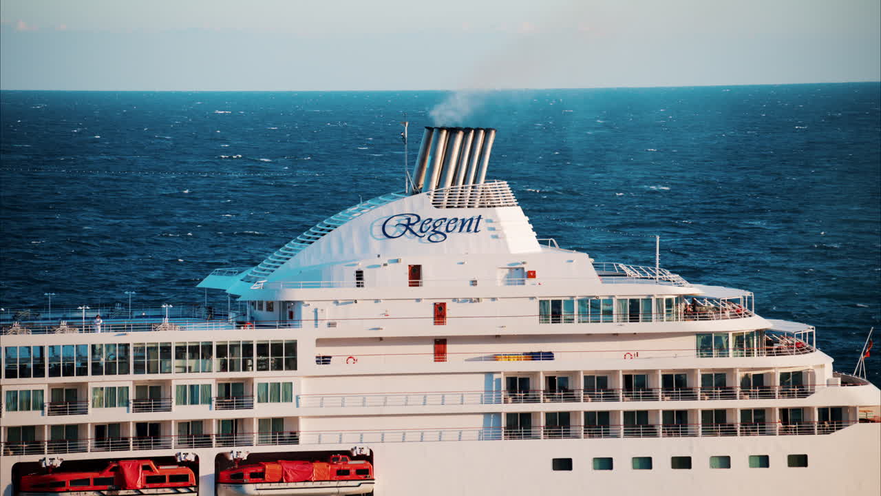 Monte Carlo, Monaco - October 14, 2024: Large cruise ship docked in the Monaco Marina in the evening